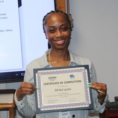 Photo of Afrika Lyons with her certificate