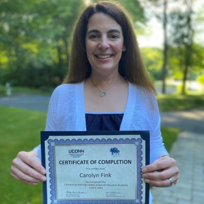 Photo of Carolyn Fink with her certificate