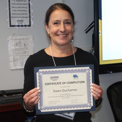 Photo of Dawn Ducharme with her certificate