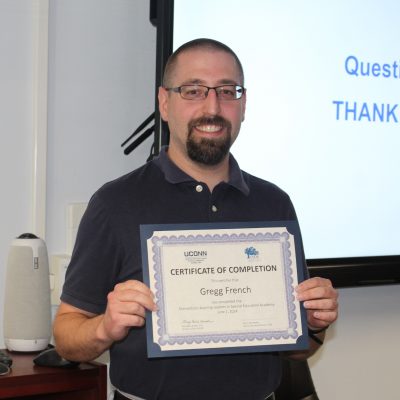 Photo of Gregg French with his certificate