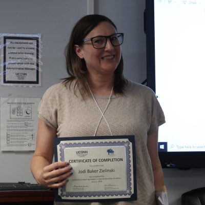 Photo of Jodi Zielinksi with her certificate