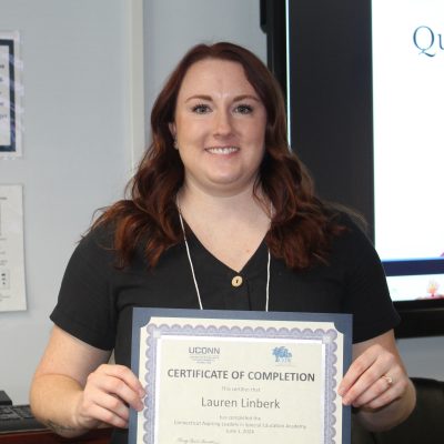 Photo of Lauren Linberk with her certificate