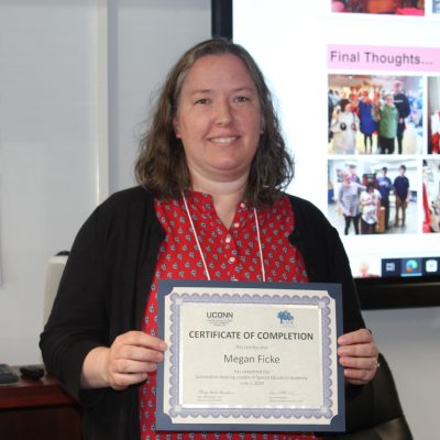 Photo of Megan Ficke with her certificate