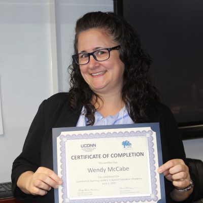 Photo of Wendy McCabe with her certificate